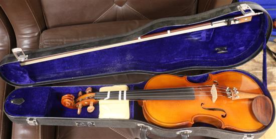 A Stentor ¾ violin, with case and a half size violin